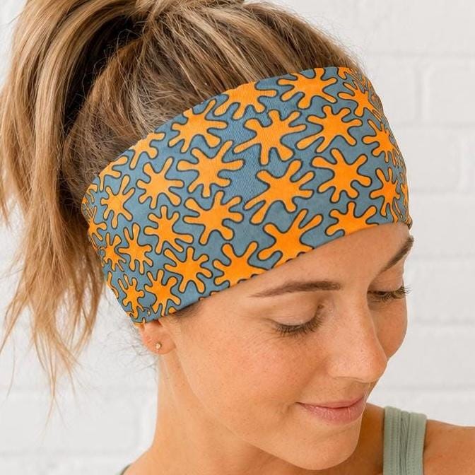 Orange Splat Moisture Wicking, non slip, athletic headband. Womens workout headband. Running headband.